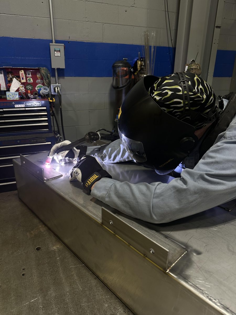 Hay's Welding welder TIG welding an aluminum fabrication in the shop